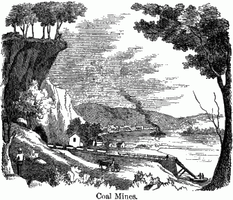 Coal Mines. A low valley with a mining operation in the foreground.