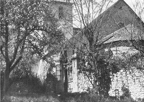 BETWEEN BRANCHES FULL OF APPLE-BLOSSOMS, THE CHURCH AS THE CURÉ SAW IT