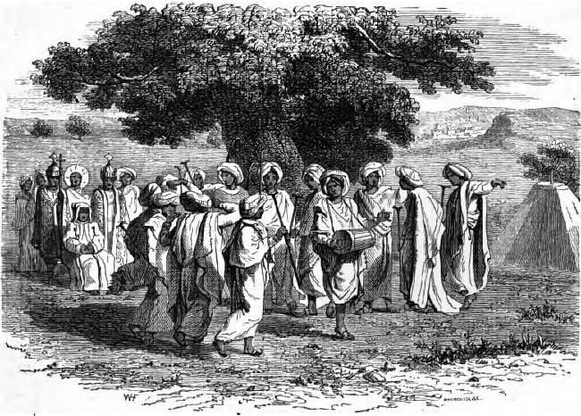 Debteras vor dem Abuna singend und tanzend. Nach Lefêbvre. Debteras vor dem Abuna singend und tanzend. Nach Lefêbvre.