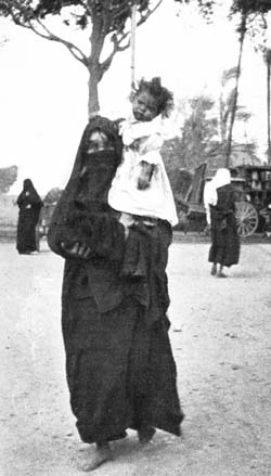 ASTRIDE ITS MOTHER'S SHOULDERS. ASTRIDE ITS MOTHER'S SHOULDERS.